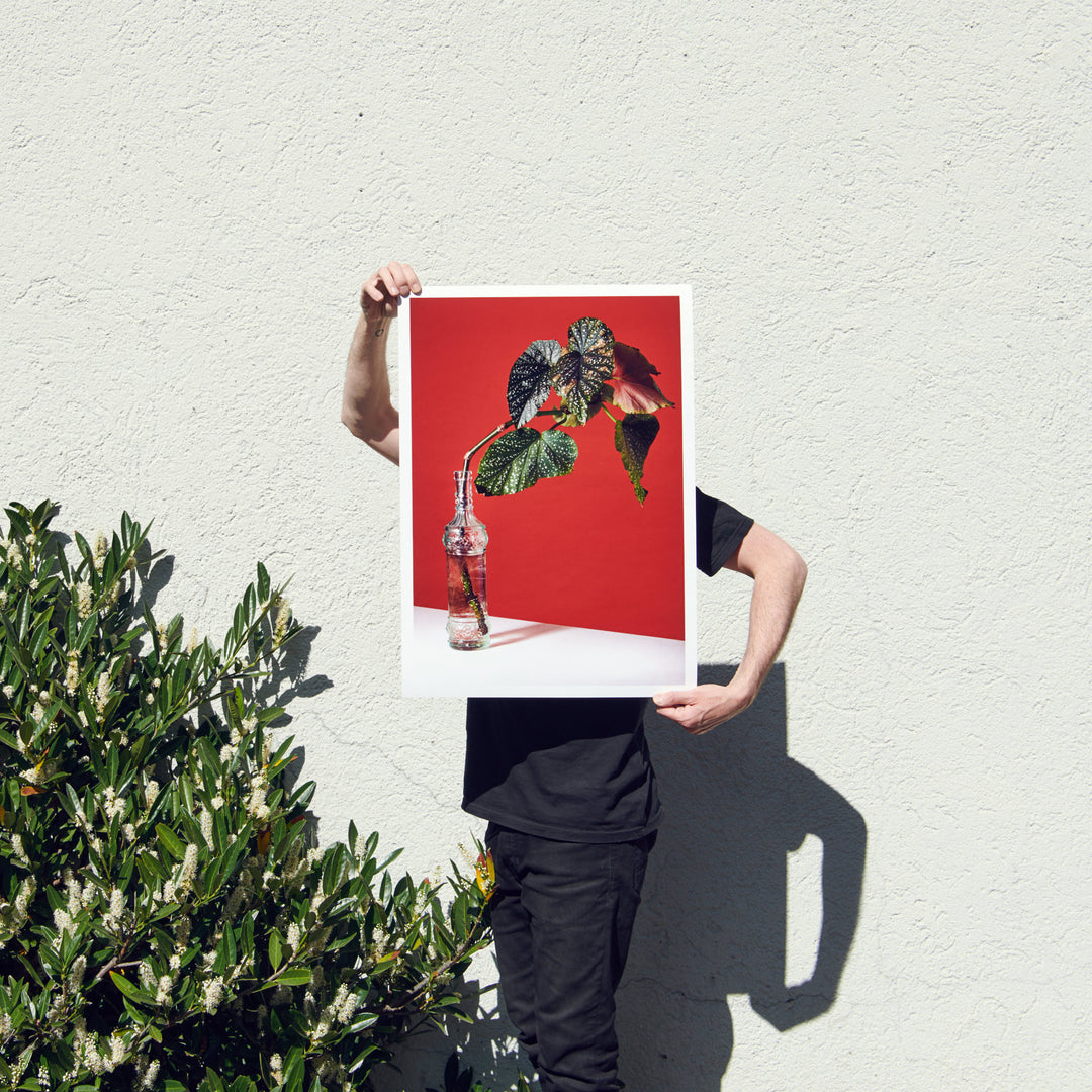 Claude Gasser holding his poster print for edition 3000