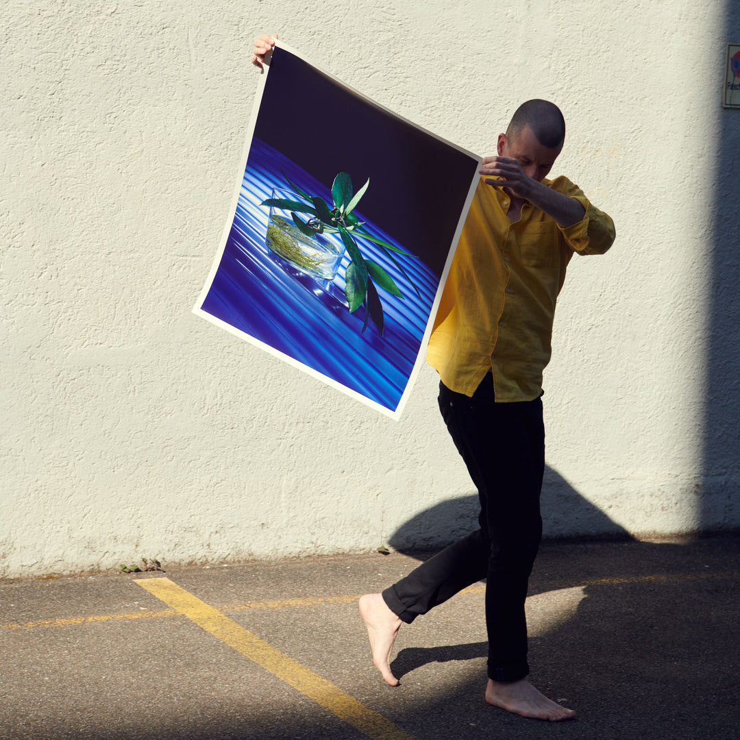 photographer Claude Gasser holding his poster for edition 3000