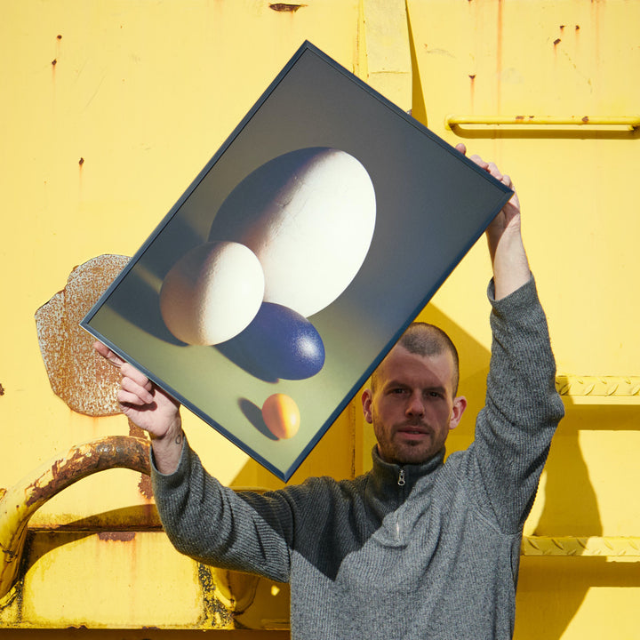 photographer Claude Gasser holding his poster Ovo for edition3000