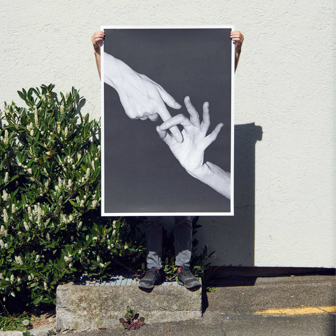 holding the finger screen print poster by Claude Gasser for edition3000